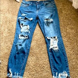 Torn dark denim jeans